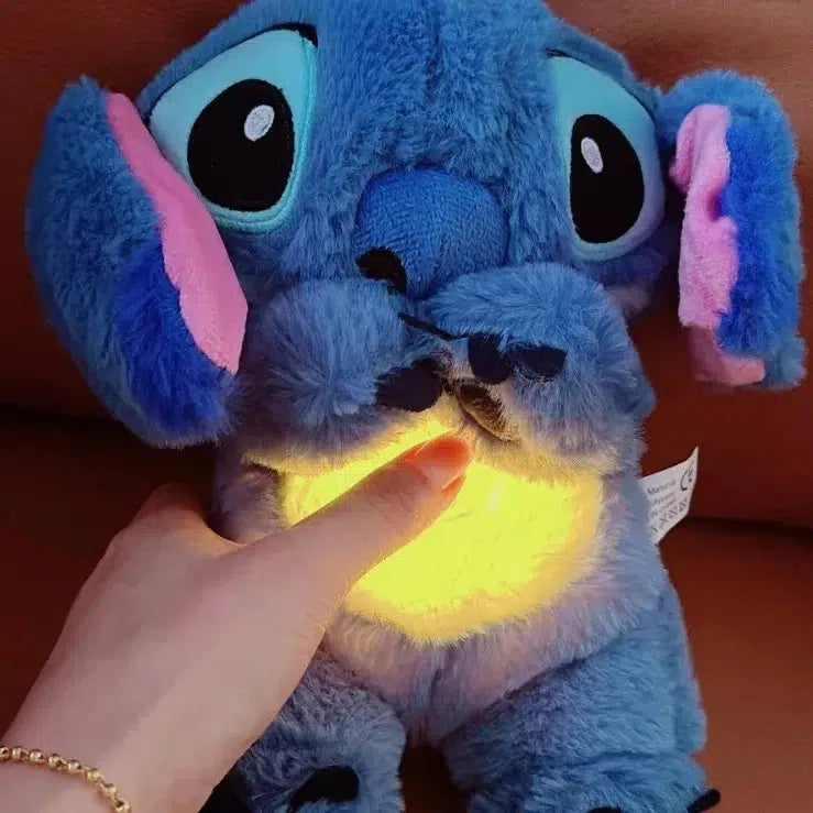 Soft character breathing plush toy with glowing belly