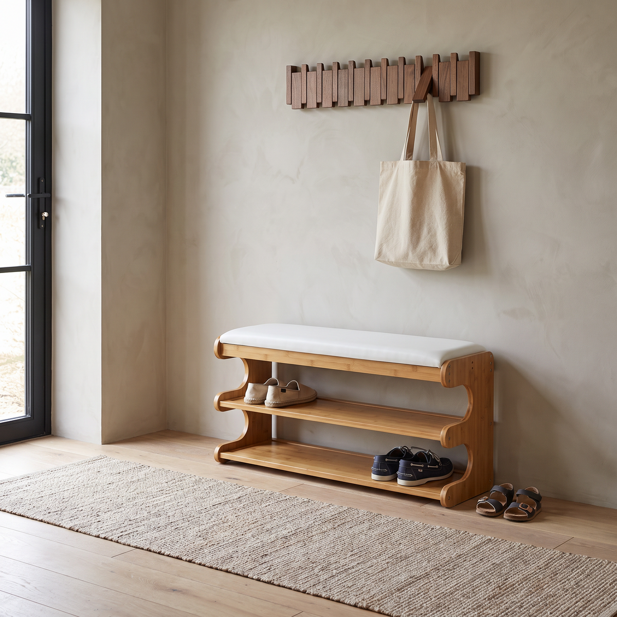 Bamboo shoe bench with white cushioned seat and two storage shelves