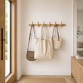 Brown oak wood wall-mounted coat rack with angled pegs