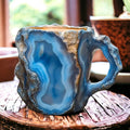 Handmade mineral crystal mug with textured stone-effect finish and sculptural handle