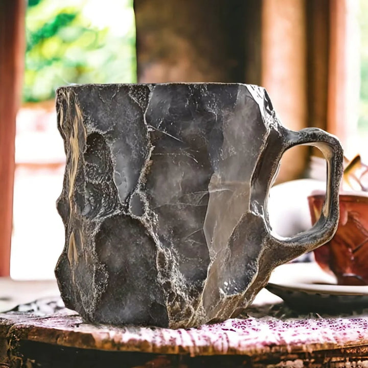 Handmade mineral crystal mug with textured stone-effect finish and sculptural handle