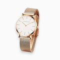 Analogue wristwatch with minimal round dial and textured mesh strap