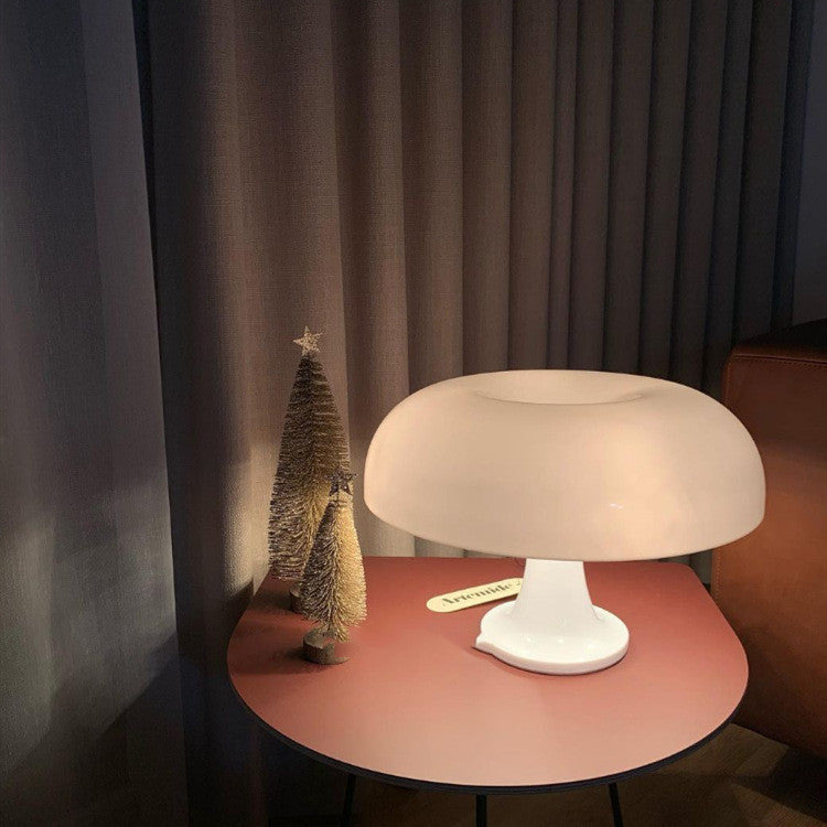 Glossy mushroom table lamp with rounded dome and circular base