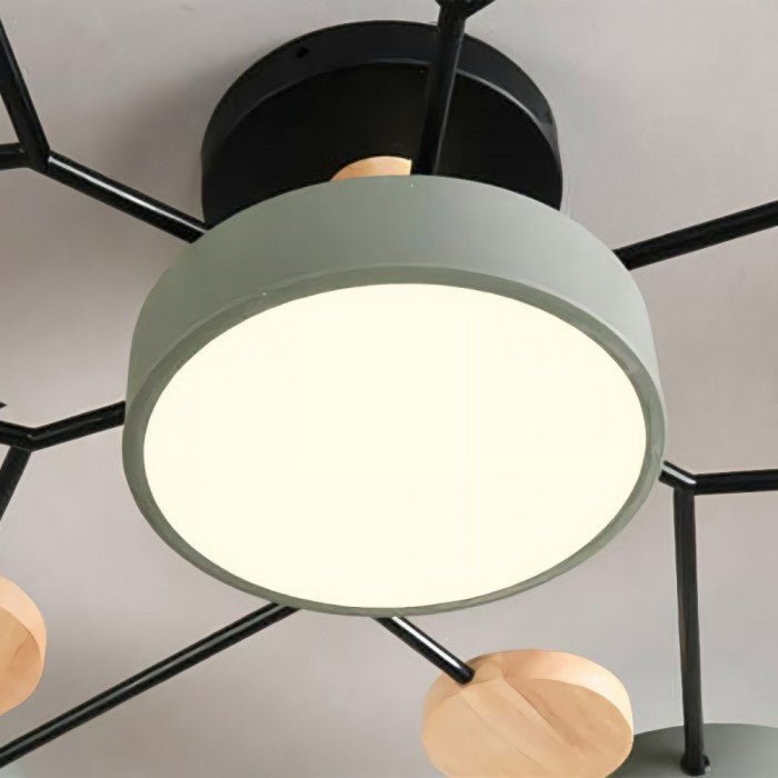 Multi-arm LED ceiling light with four round ring shades and oval decorative accents