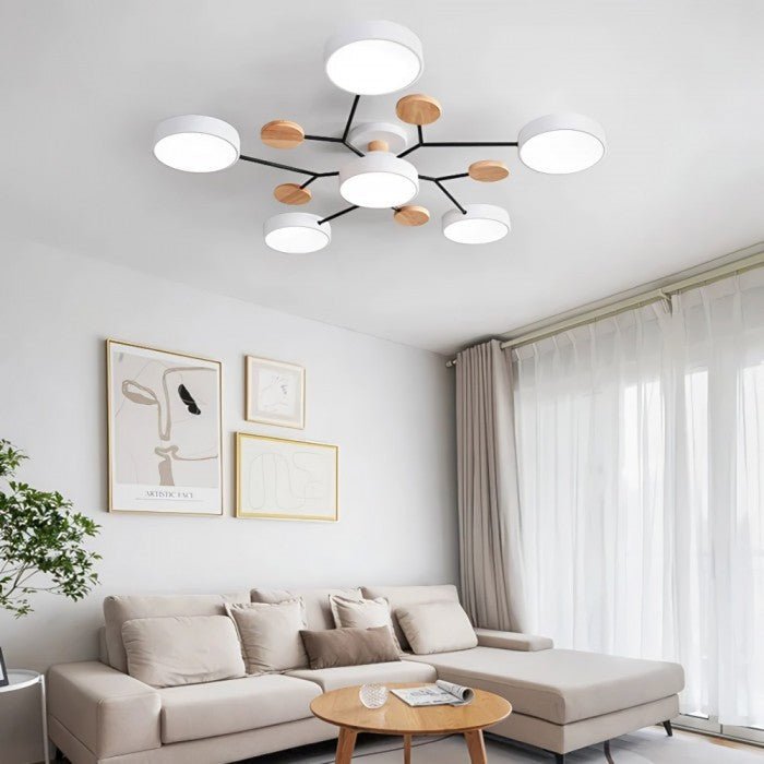 Multi-arm LED ceiling light with four round ring shades and oval decorative accents