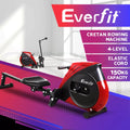 Red and black home rowing machine with padded seat and elastic resistance housing