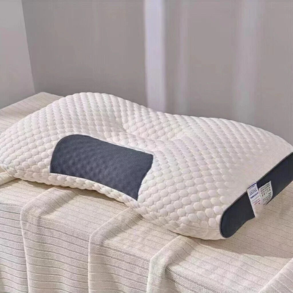 White contoured ergonomic pillow with textured cover and dark grey side panels
