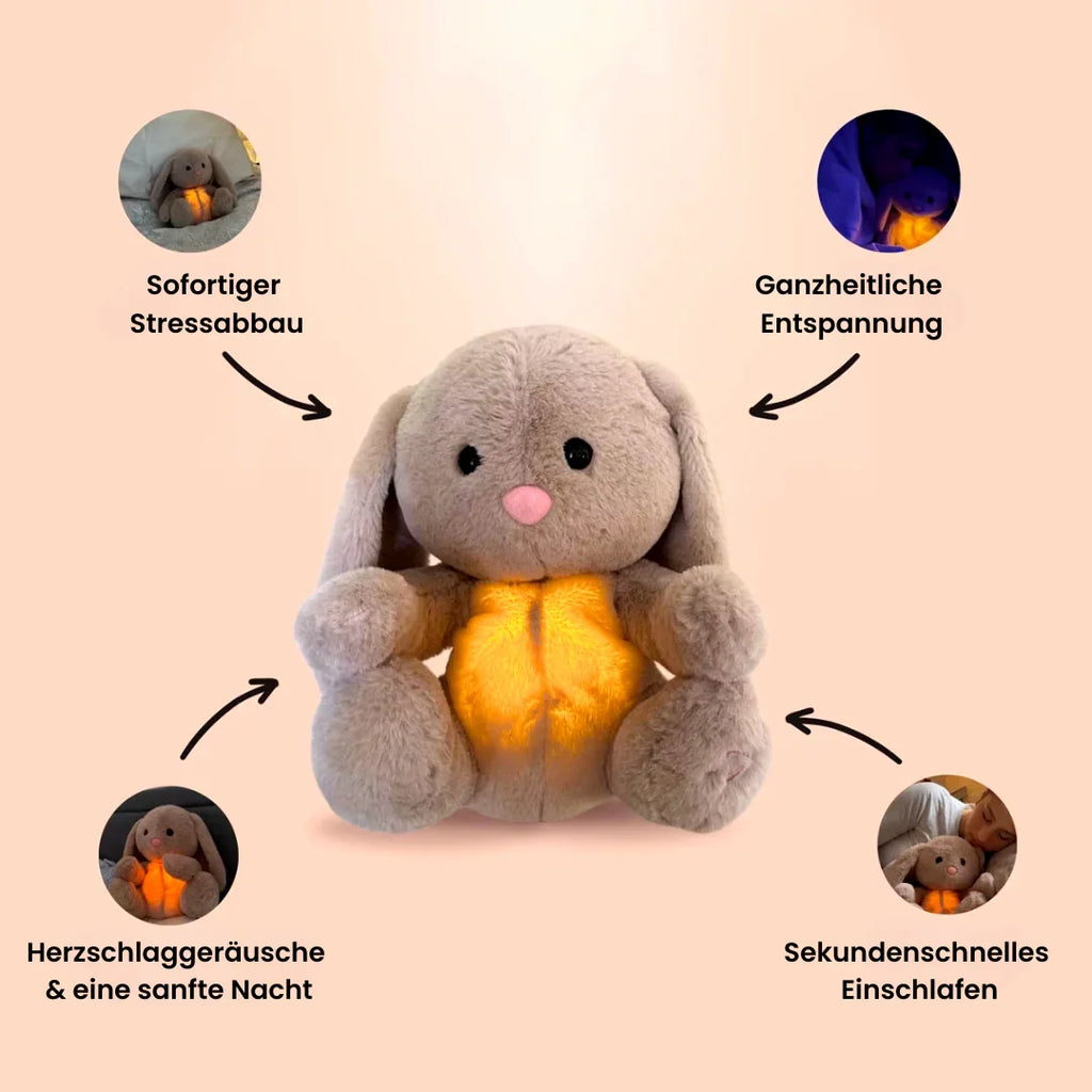 Gray bunny stuffed animal with long ears and glowing yellow belly