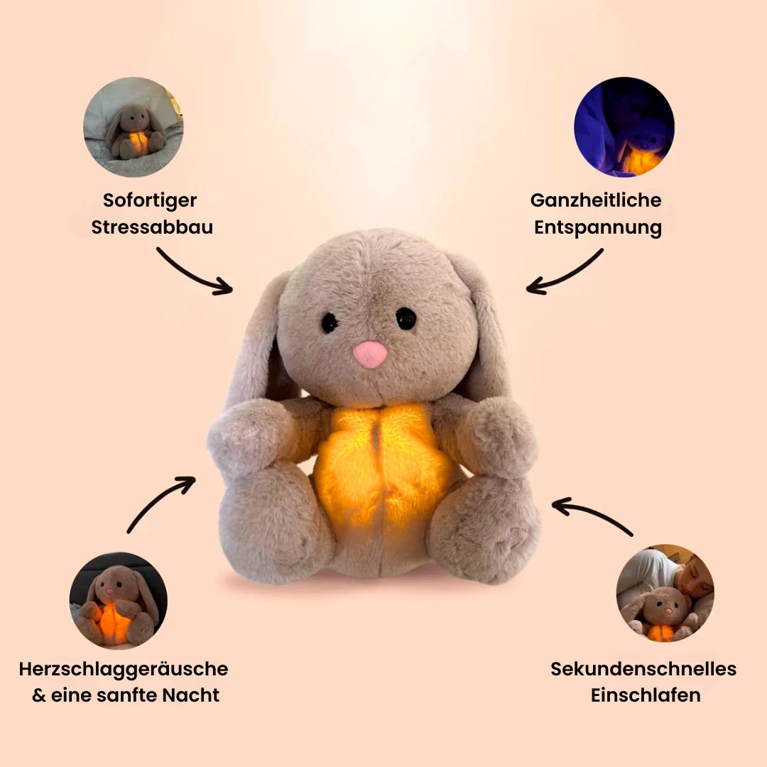 Gray bunny stuffed animal with long ears and glowing yellow belly