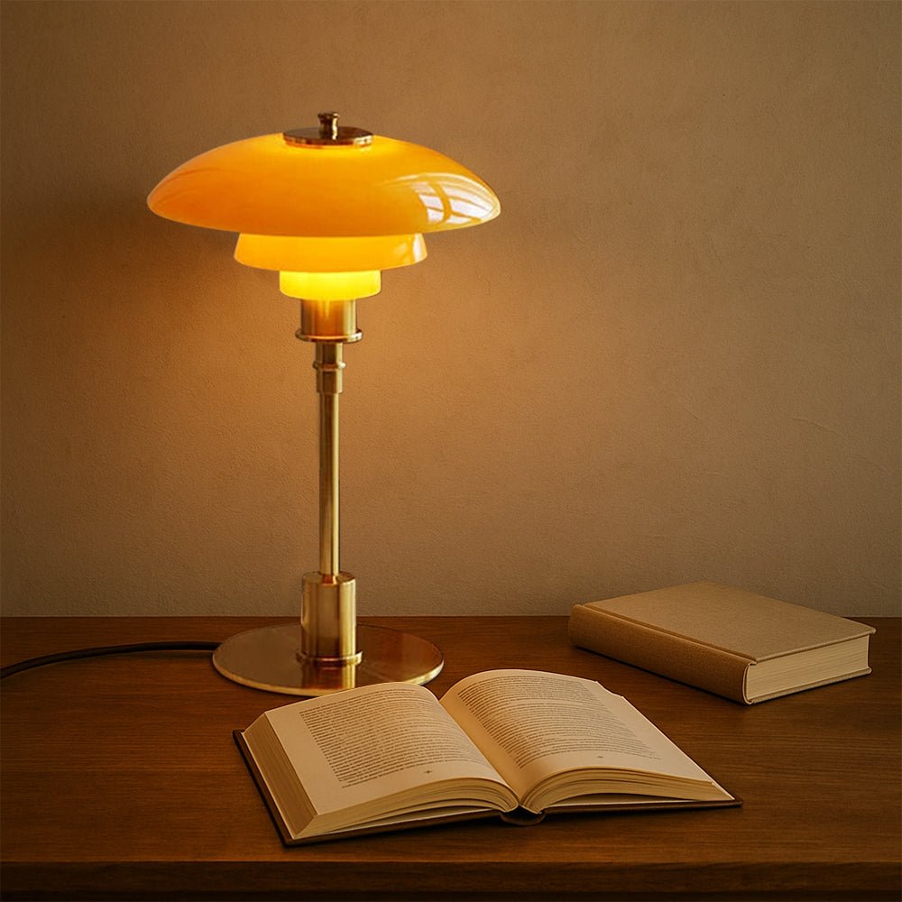Layered LED table lamp with dome shade and circular metallic base