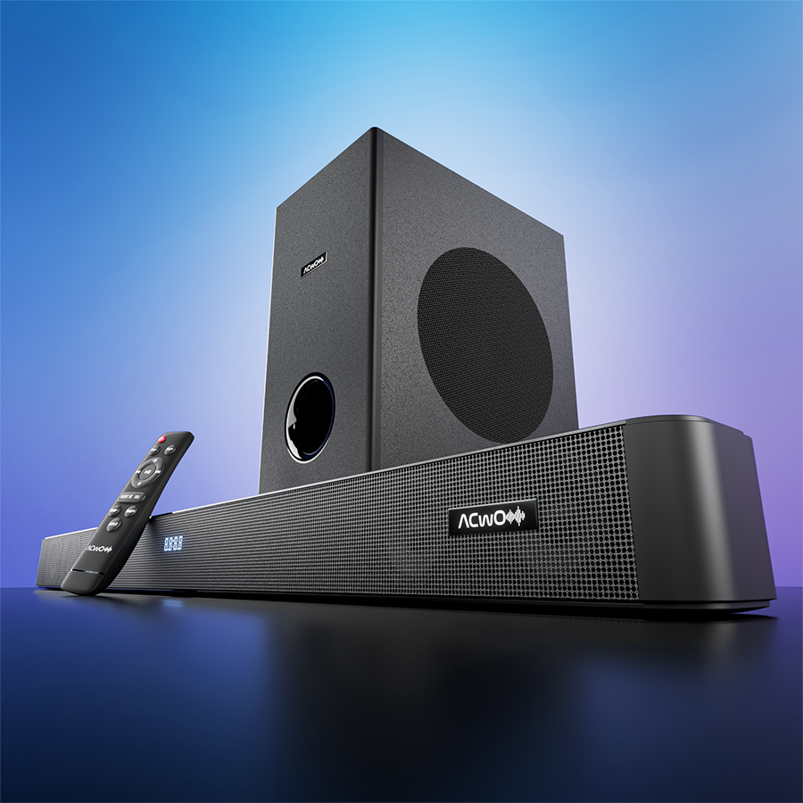 Black soundbar speaker system with separate subwoofer and remote control