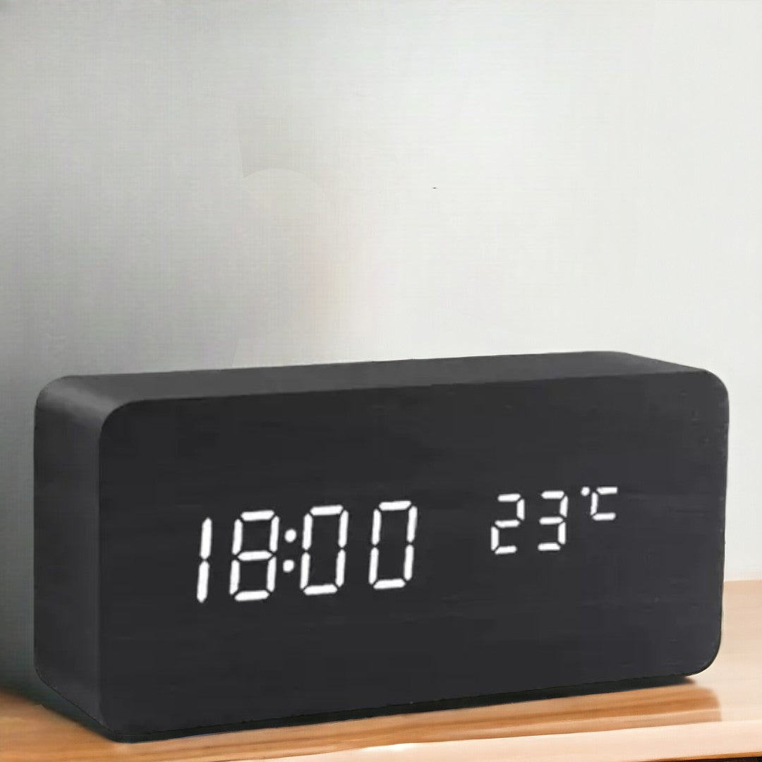 Compact rectangular LED smart alarm clock showing digital time and temperature